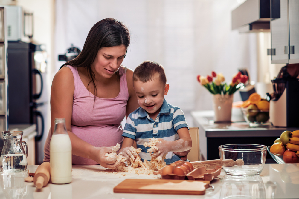 Mother and child baking together